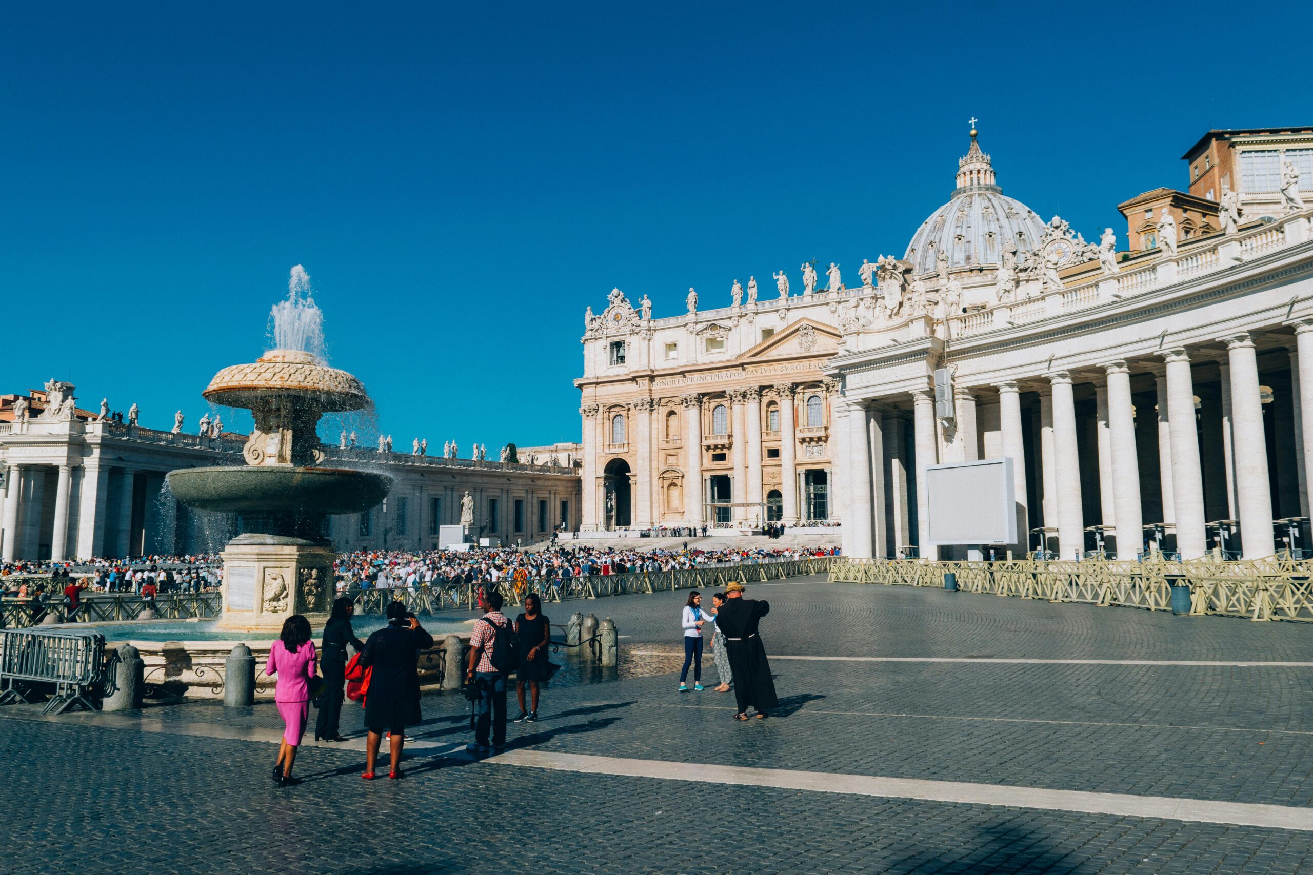 Photo by Kai Pilger: https://www.pexels.com/photo/white-building-and-people-standing-near-water-fountain-1243538/
